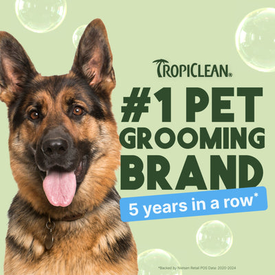 German Shepherd with Tropiclean branding claiming #1 pet grooming brand for 5 years on a light green background.